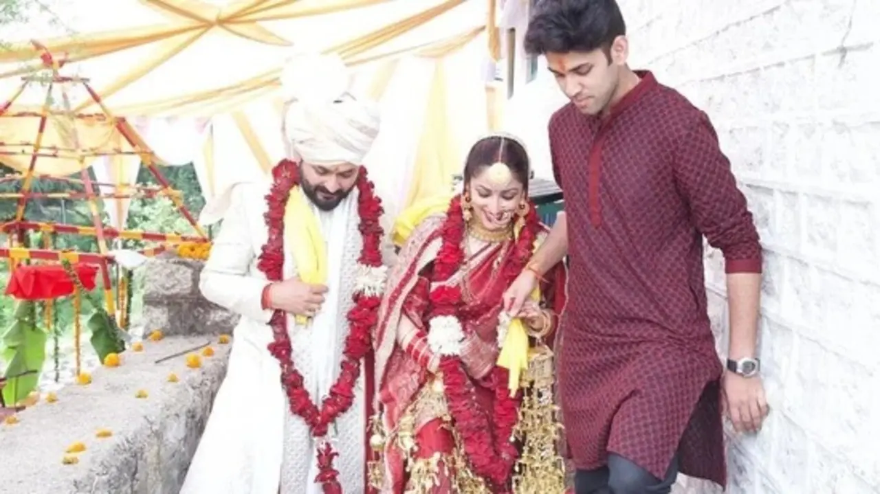 This picture is also from their wedding ceremony, where Yami's brother Ojas is seen leading the couple.