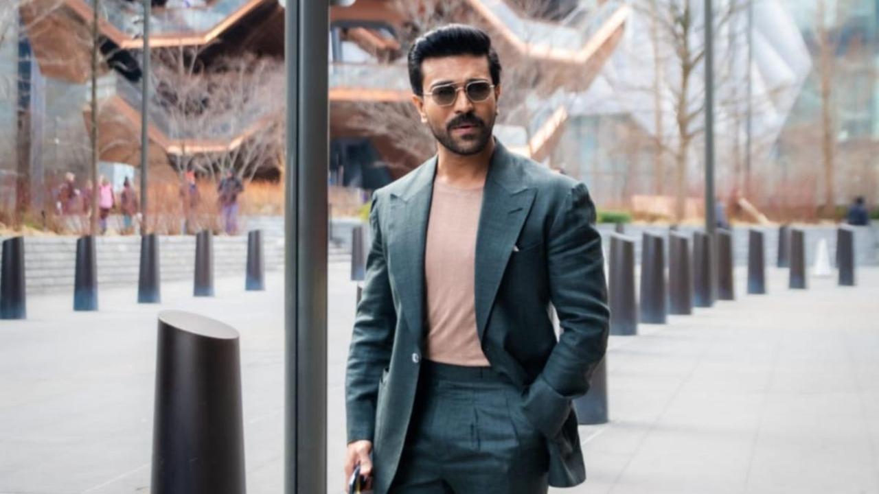 Giving the suit a laidback yet stylish twist, he pairs it with a beige round-neck t-shirt. The sunglasses bring in added swag.