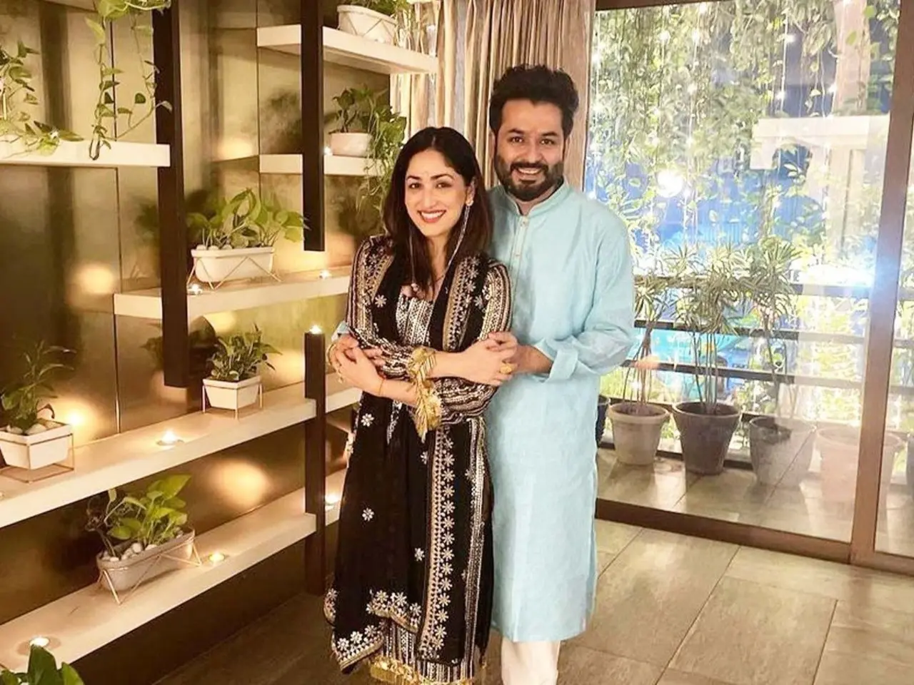 The Dhurandhar maker holds wife and actress Yami Gautam close in this picture, which seems to be from a festival celebration at their home.