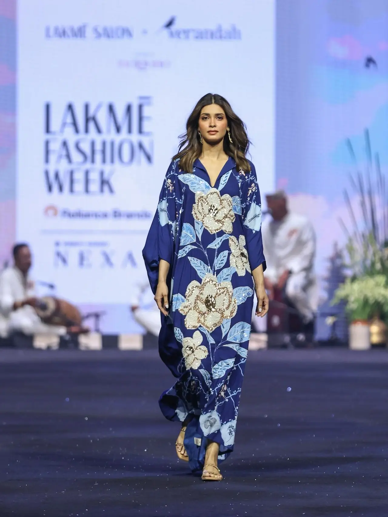 Diana Penty looked easy, breezy and stylish in Verandah's navy blue, embellished magnolia maxi kaftan featuring an artistic floral and geometric print and a fluid silhouette. 