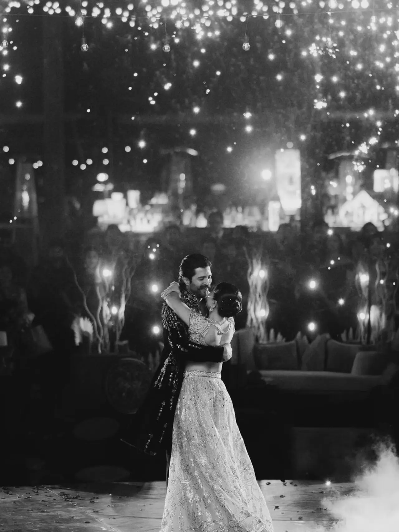 Vijay and Rashmika are seen engrossed in a romantic and dreamy moment as they dance at thier sangeet night surrounded by fireworks. 