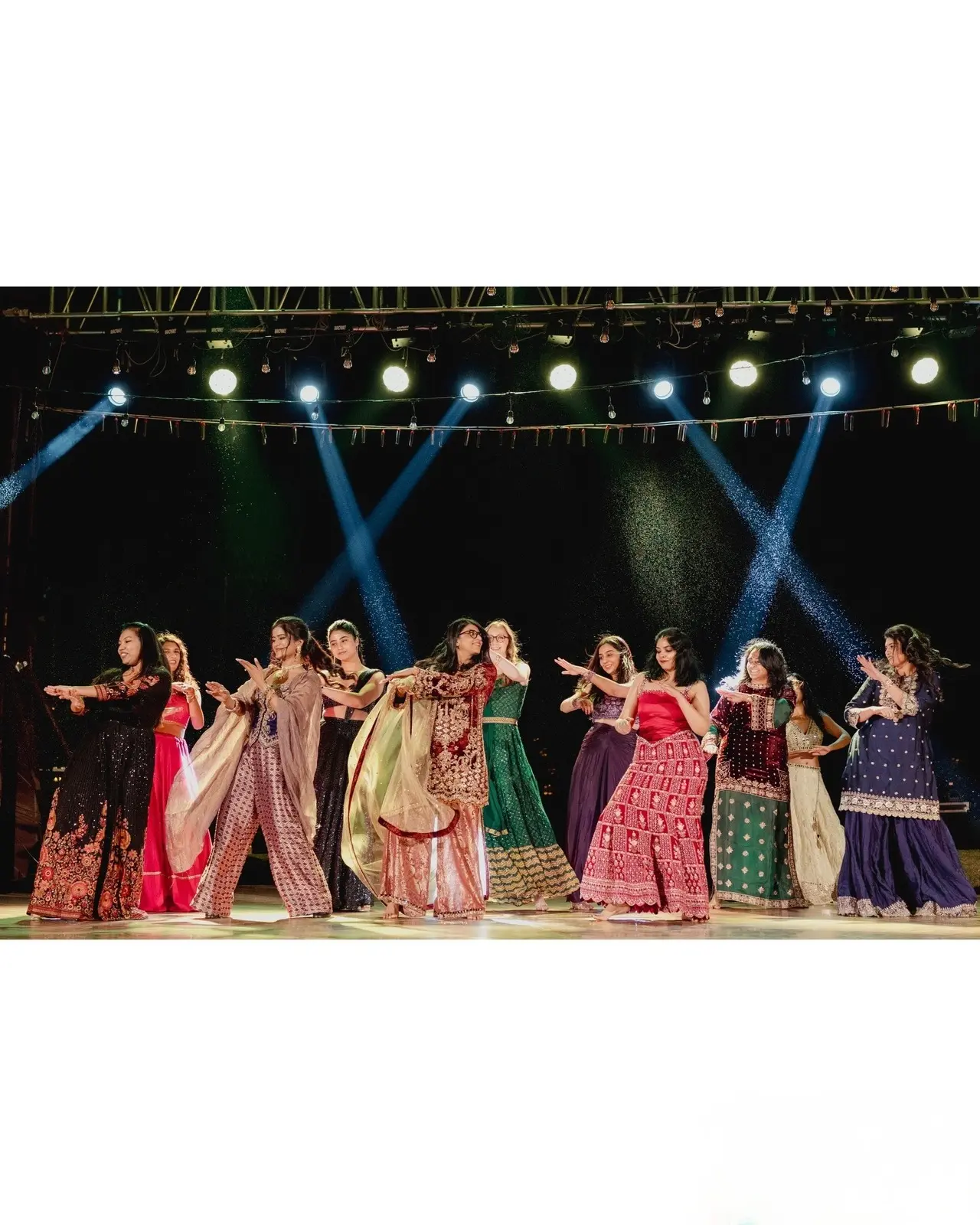 The couple also shared a picture of their friends performing a dance set on stage during their sangeet.