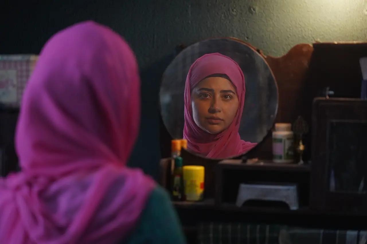 Aditi also shared a scene from the film where she is seen dressed in a hijab as she looks at herself in the mirror.
