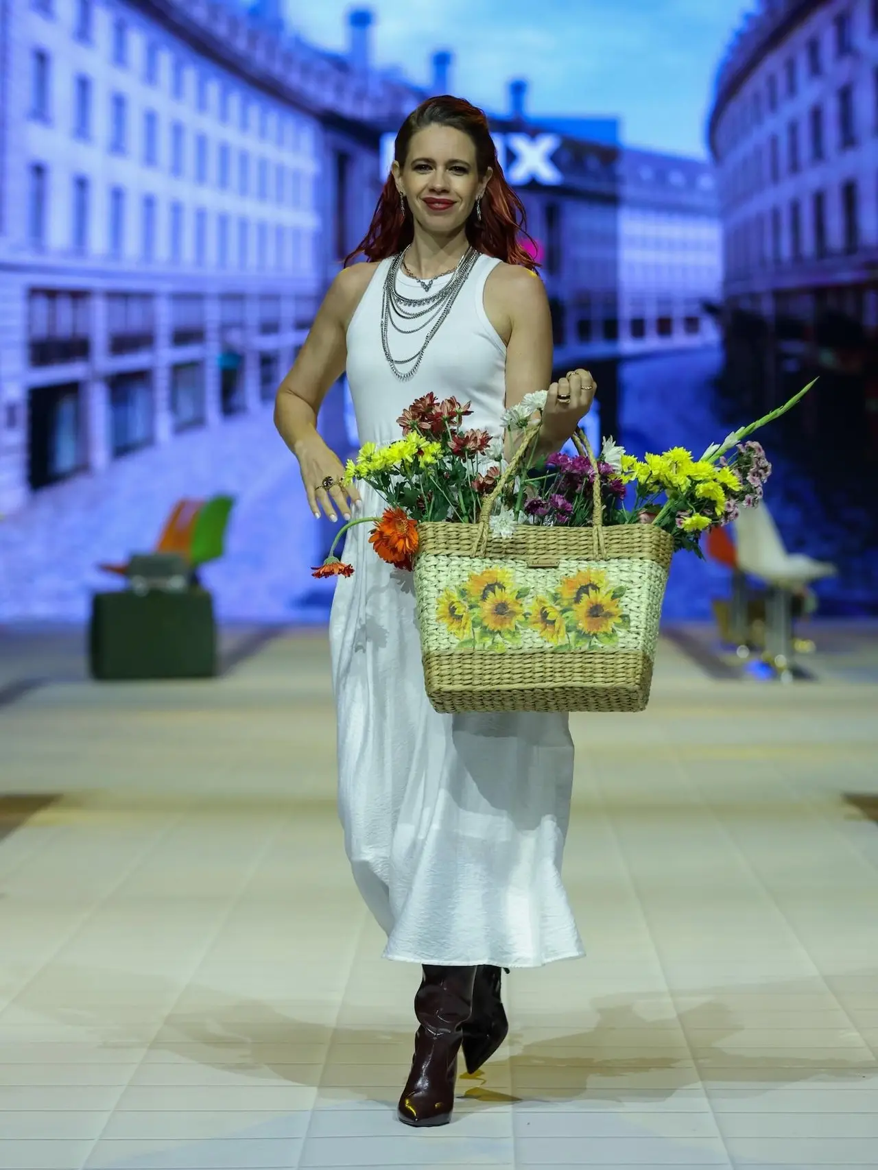 Kalki Koechlin walked for Max Fashion on a minimalist, all-white ensemble featuring a sleeveless top and midi skirt. She also carried a bag full of flowers to complete the look