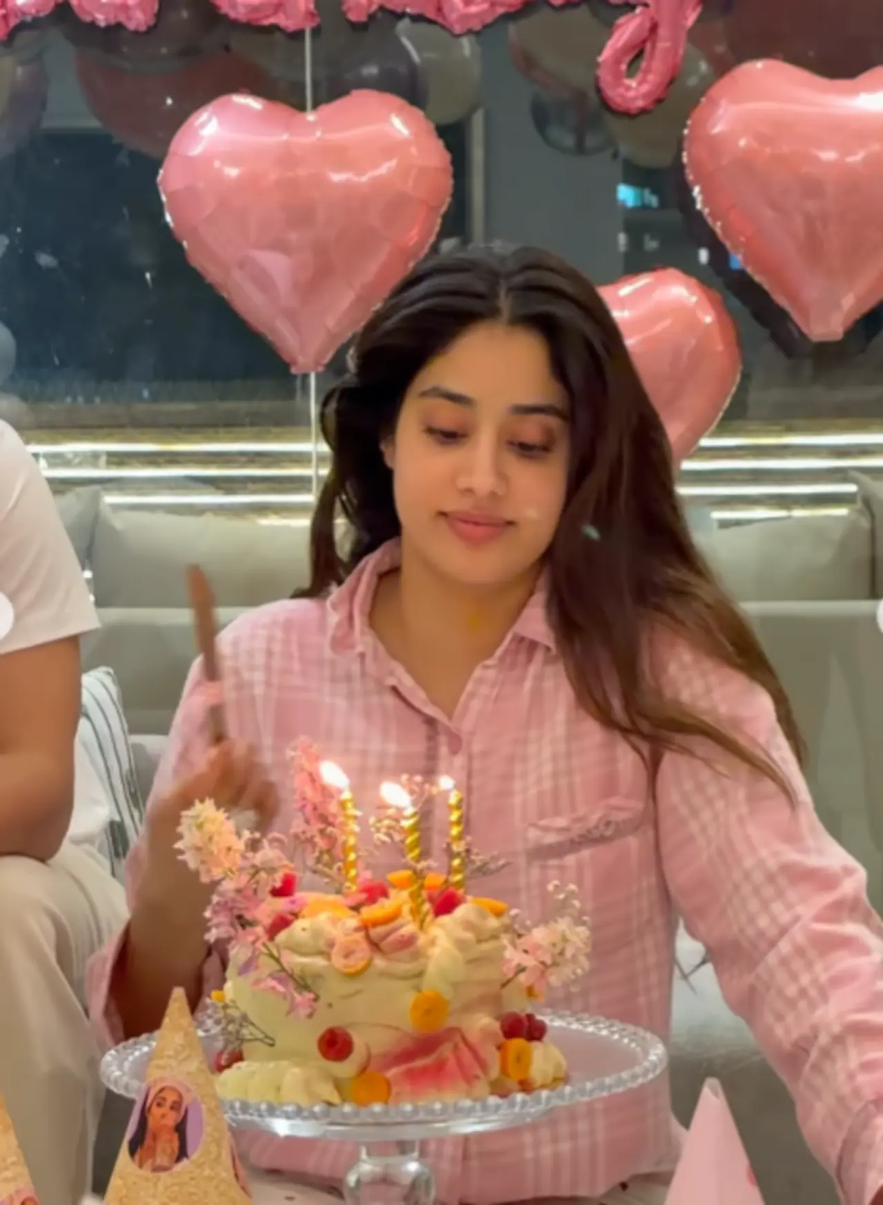 In one video, Janhvi was seen cutting her Keto birthday cake, dressed in pink nightsuit surrounded by balloons.