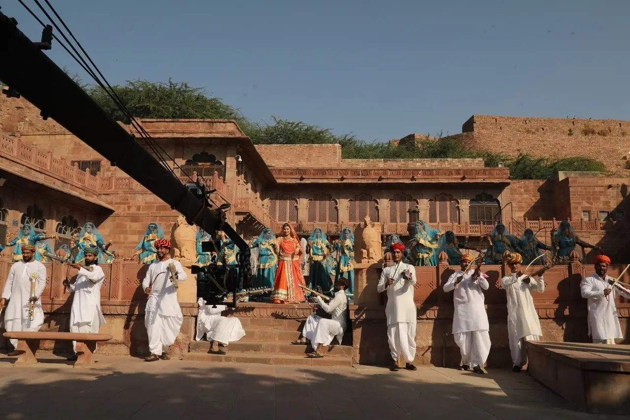The actress is seen performing a dance sequence with background dancers as the camera shoots the sequence.