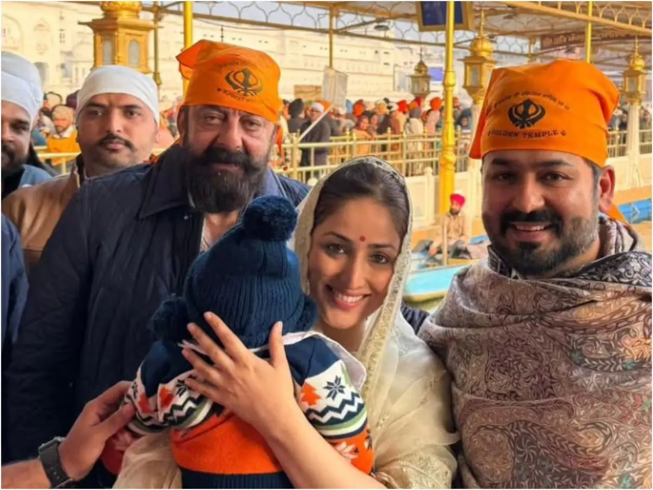 Aditya is seen with his wife, Yami, who holds their son in her arms, and Sanjay Dutt, seemingly visiting the Golden Temple.