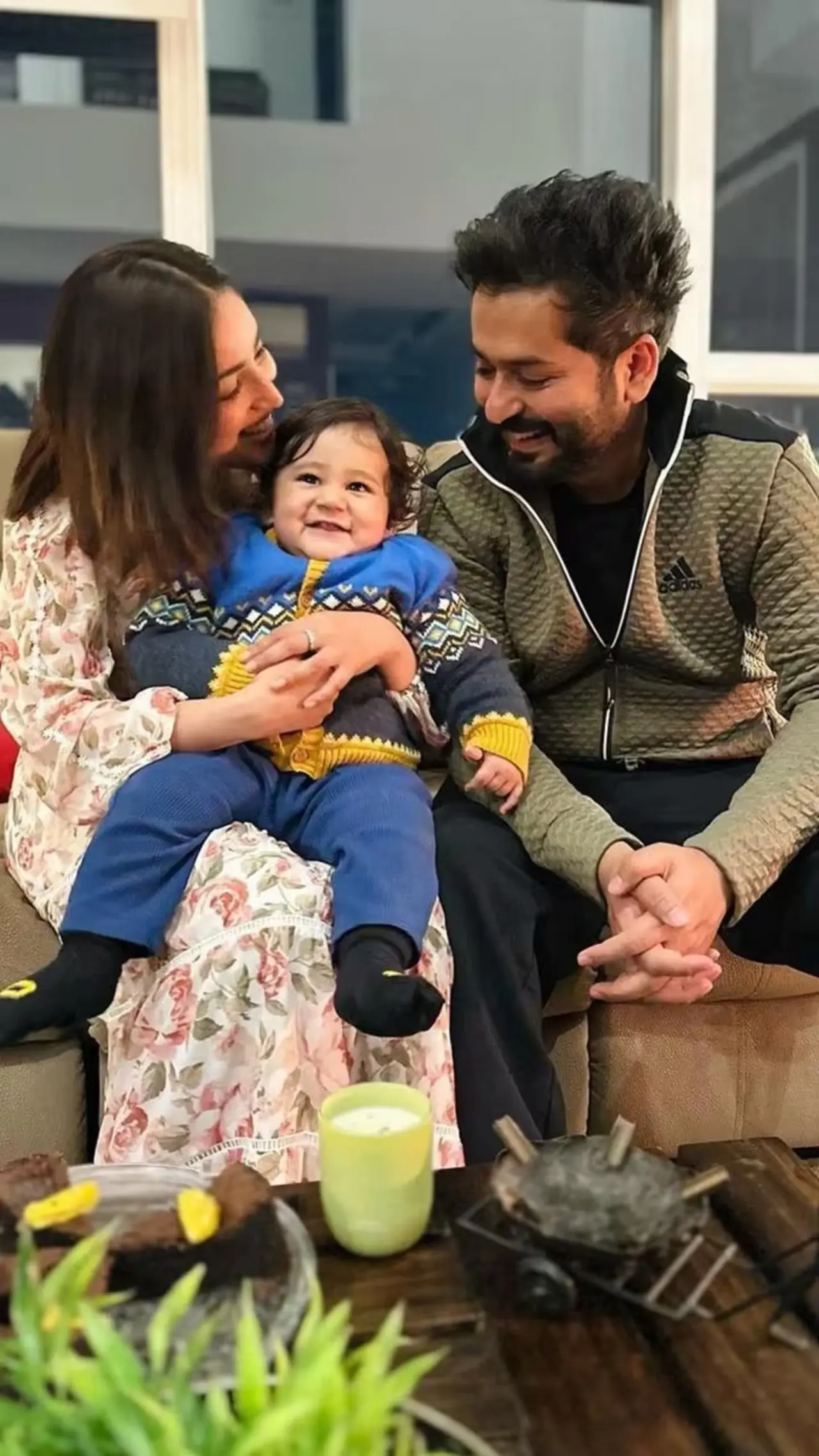 Aditya cannot stop adoring his son Vedavid as Yami kisses the little boy on his forehead.