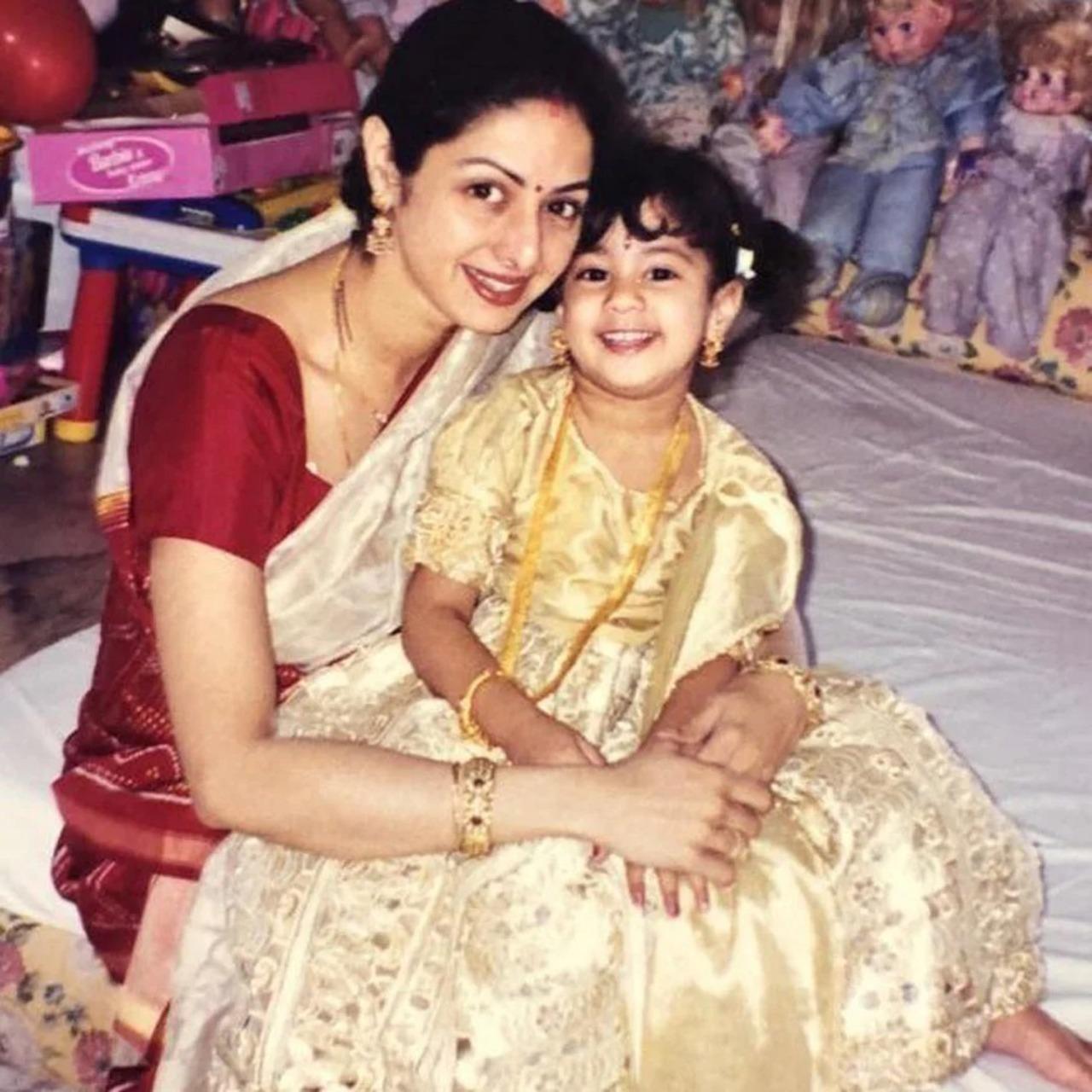 Decked up in traditionals, Janhvi cutely and joyfully sits on mother, Sridevi's lap as they strike an adorable pose together.