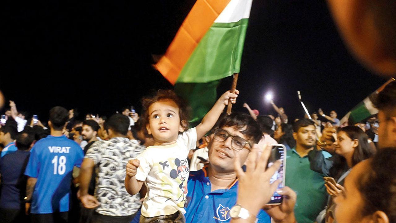 Fans celebrate at Marine Drive, with flags, fireworks, and cheers