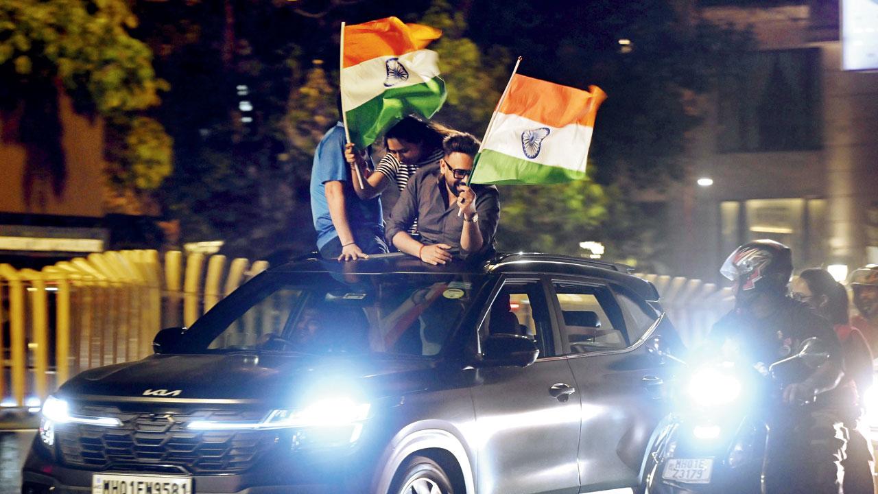 Fans waved the Indian tricolour from their car as thousands of people came out on the streets after the T20 World Cup final