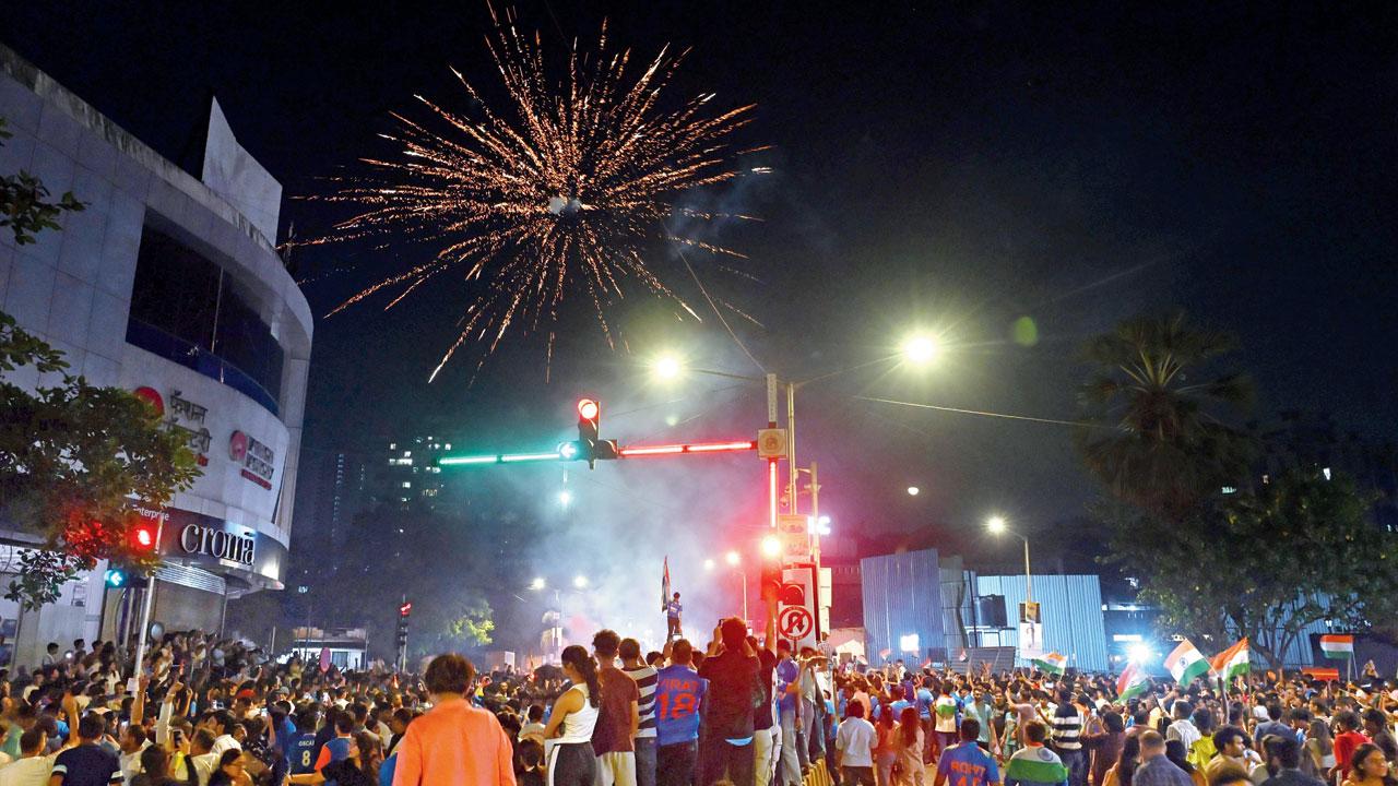 Fans celebrate on Borsapada Road in Kandivli