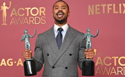 US actor Michael B. Jordan poses with the awards for Outstanding Performance by a Male Actor in a Leading Role and Outstanding Performance by a Cast in a Motion Picture for 
