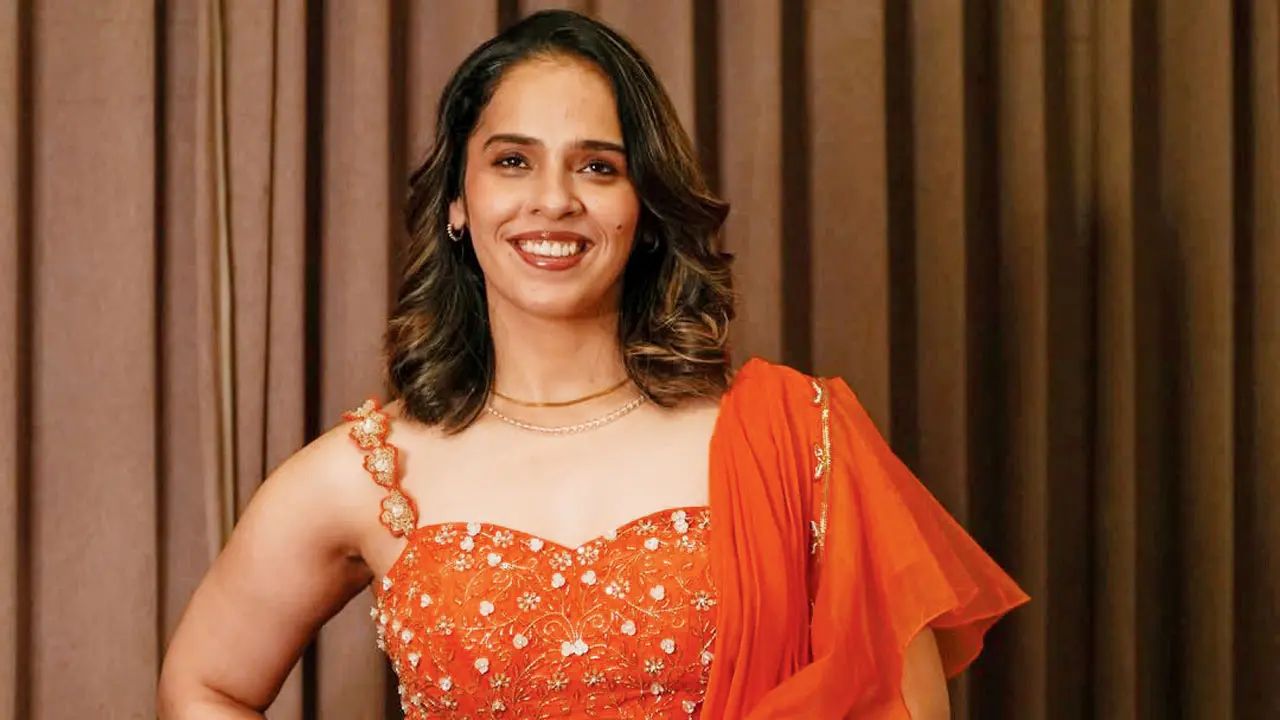 Saina shimmers in orange