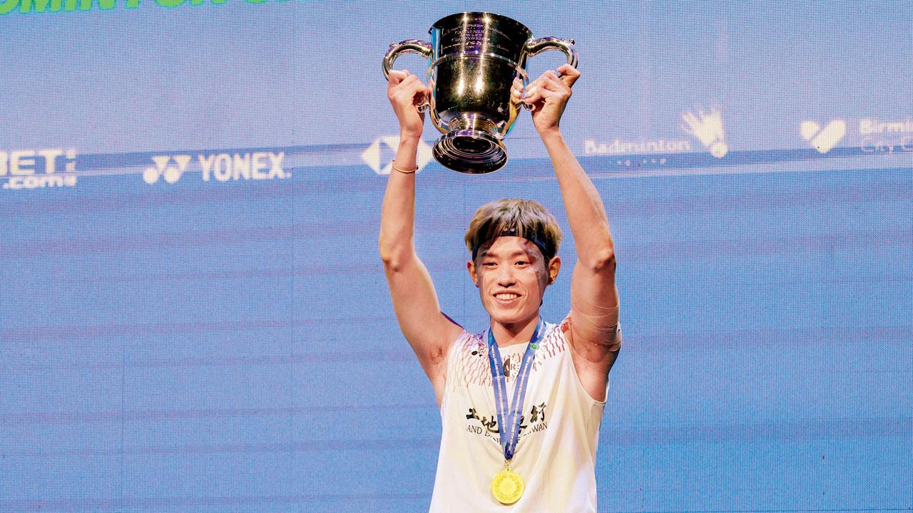 Chinese Taipei’s Lin Chun-Yi with the All England Open Championships winner’s trophy