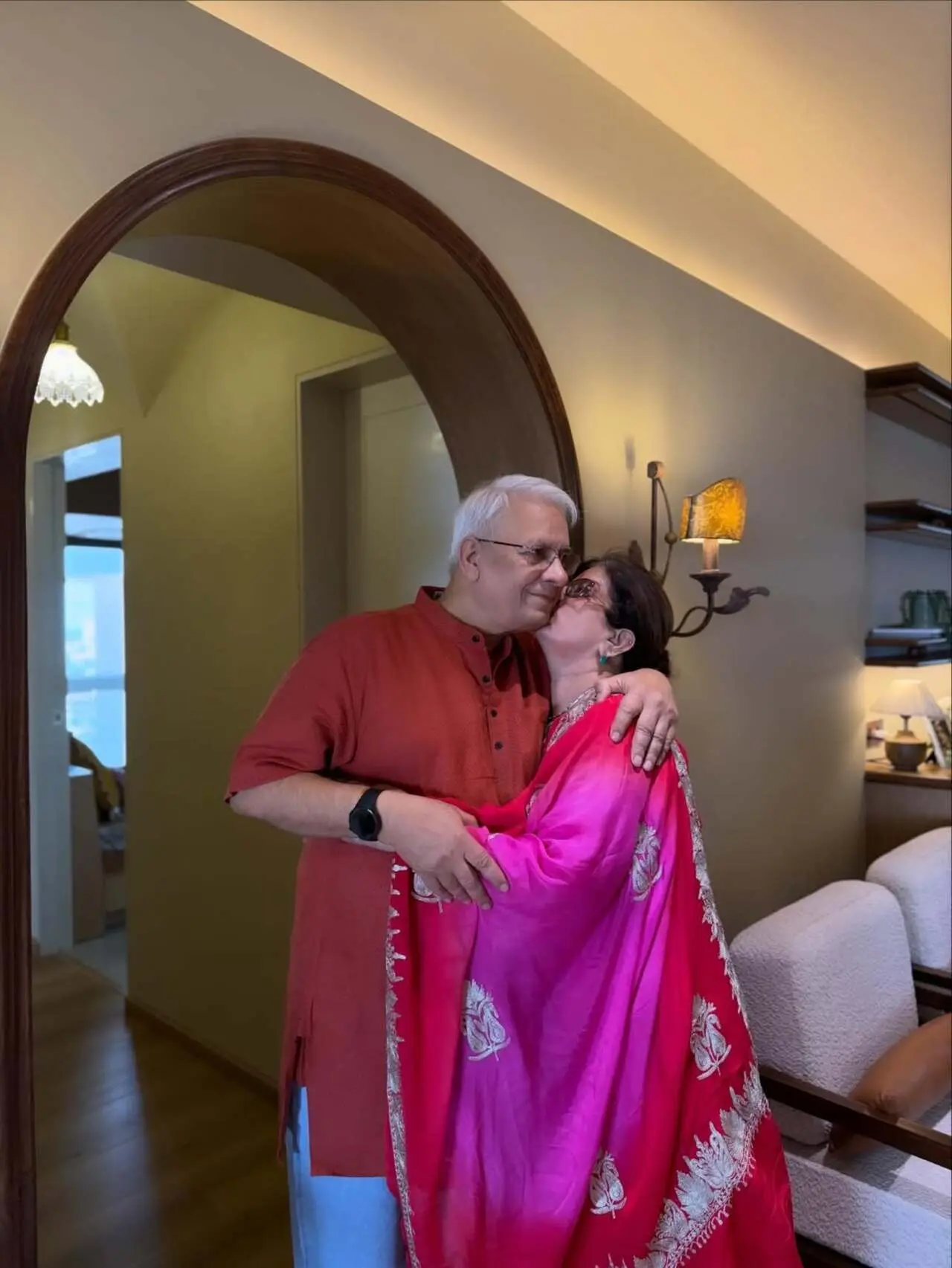 Traditional celebration moments: Friends and family are seen dressed in traditional outfits, suggesting a housewarming or festive gathering