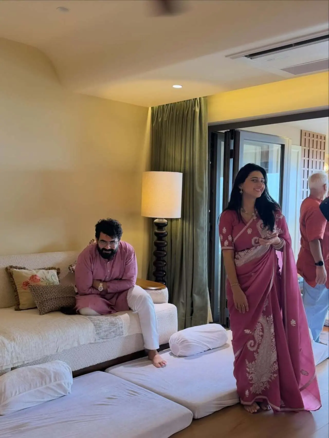 Warm neutral interiors: The living room features beige sofas, wooden flooring, and soft lighting for a warm, inviting vibe