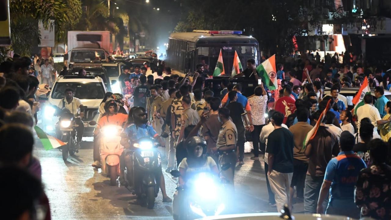 Many people gathered in groups, waved the national flag and cheered for the team while vehicles moved through the streets honking in celebration