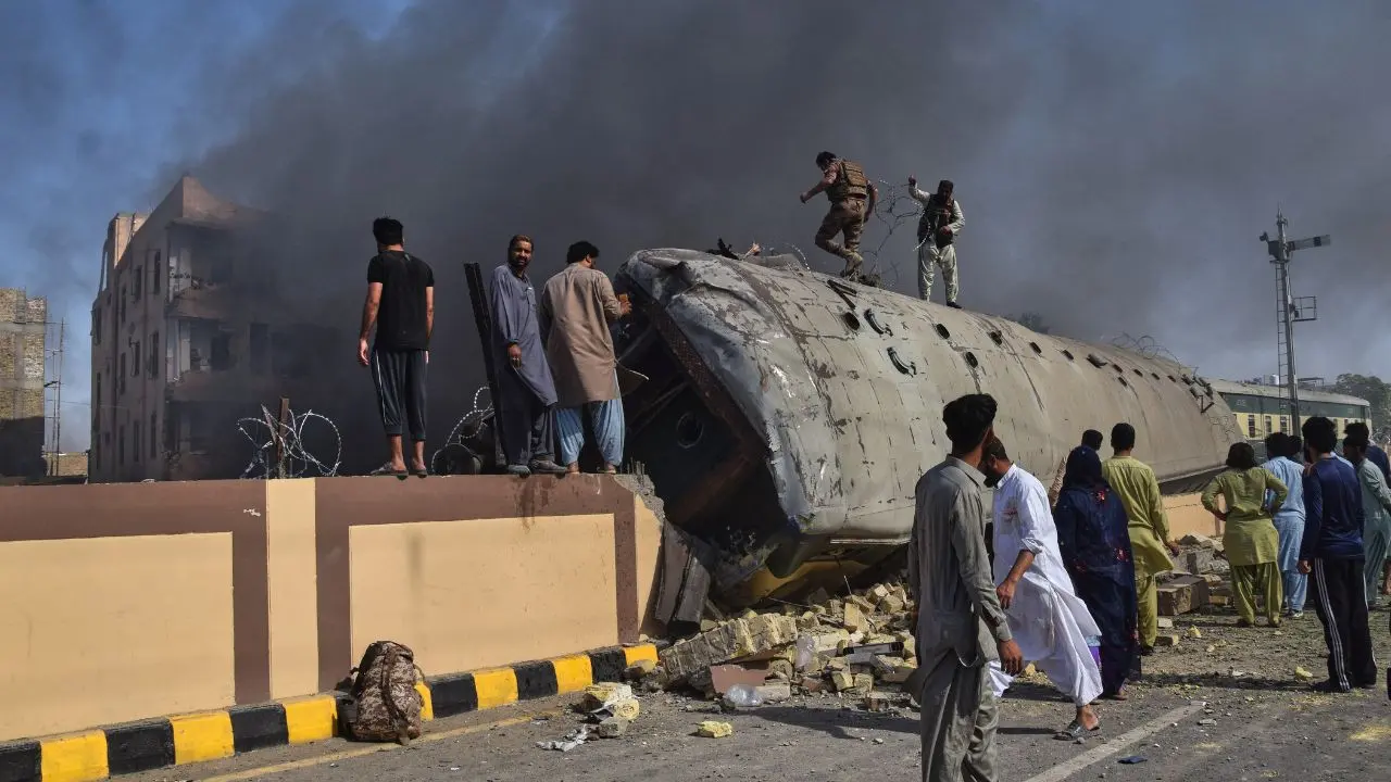 IN PHOTOS: Pakistan train blast kills 24, rescue ops continue amid wreckage Overturned train coaches lie scattered across the tracks as rescue workers search for survivors trapped inside. PIC/AP