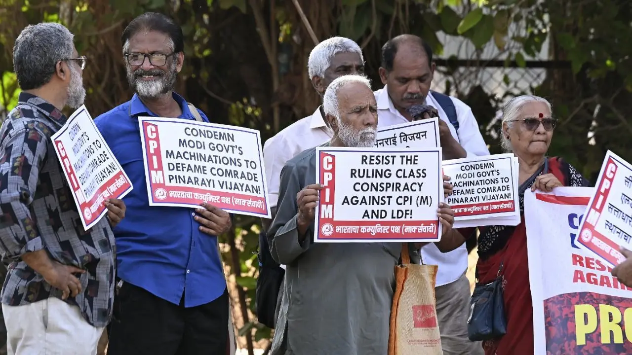 IN PICS: CPM stages protest in Mumbai over raid at Pinarayi Vijayan’s residence CPM activists of the Mumbai District Committee stage a protest at Azad Maidan on Friday