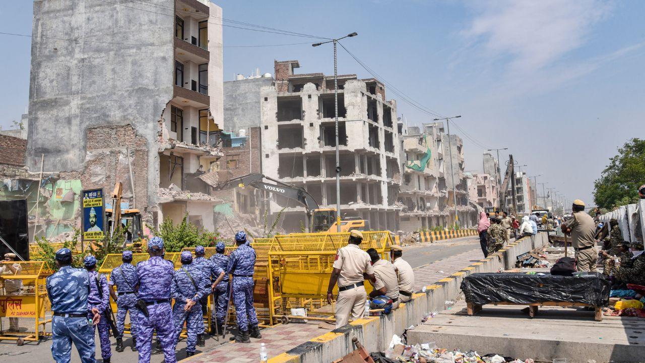 Heavy security was deployed during the demolition drive. Pics/PTI Heavy security was deployed during the demolition drive. Pics/PTI