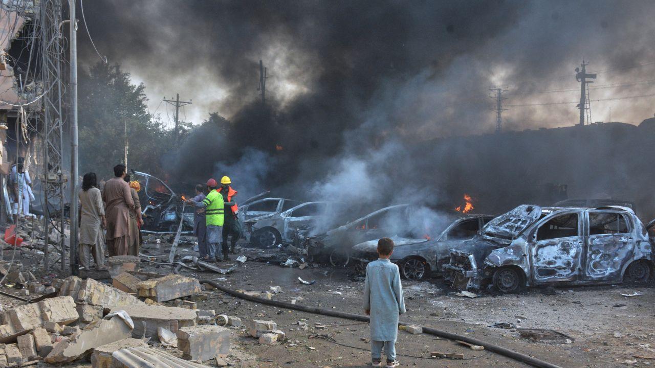Firefighters battle flames engulfing nearby vehicles damaged in the explosion that targeted the train near Chaman Pattak in Quetta Firefighters battle flames engulfing nearby vehicles damaged in the explosion that targeted the train near Chaman Pattak in Quetta 