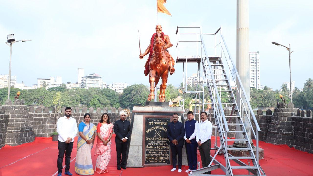 National flag at the Thane Municipal Corporation headquarters amid a ceremonial salute was hoisted with the national anthem and state song being sung