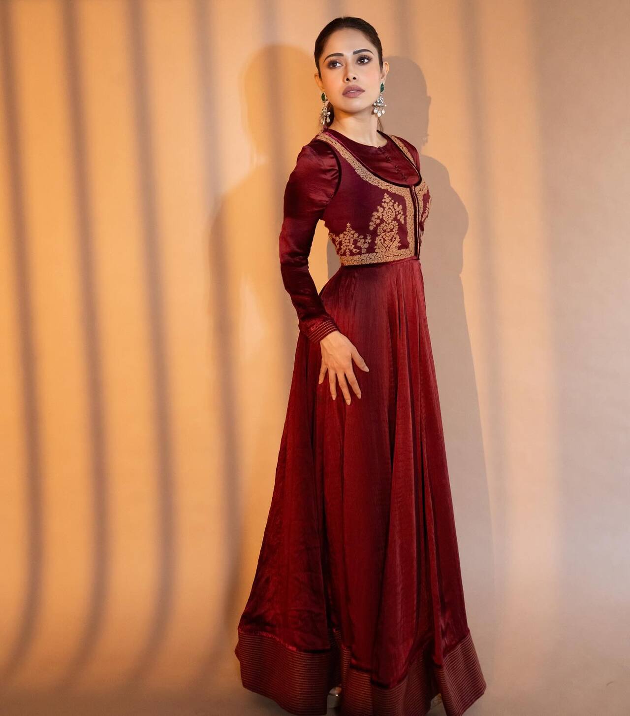 Dressed in a deep maroon Anarkali-inspired outfit, Nushrratt Bharuccha looked graceful and elegant. The ensemble featured intricate golden embroidery. Dressed in a deep maroon Anarkali-inspired outfit, Nushrratt Bharuccha looked graceful and elegant. The ensemble featured intricate golden embroidery.