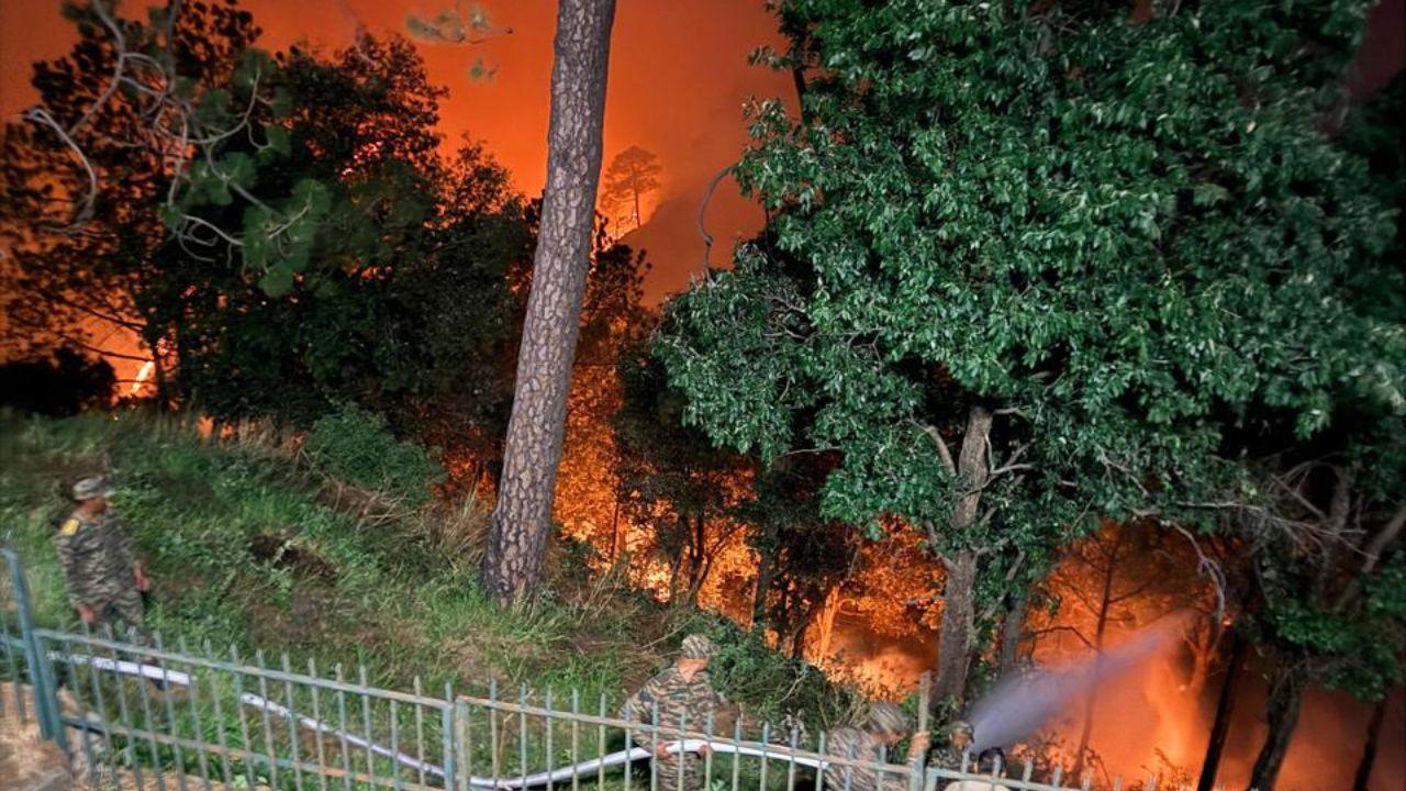 Army personnel move through smoke-filled slopes and forest tracks as they battle the wildfire that threatened sensitive and historic zones of the hill town Army personnel move through smoke-filled slopes and forest tracks as they battle the wildfire that threatened sensitive and historic zones of the hill town