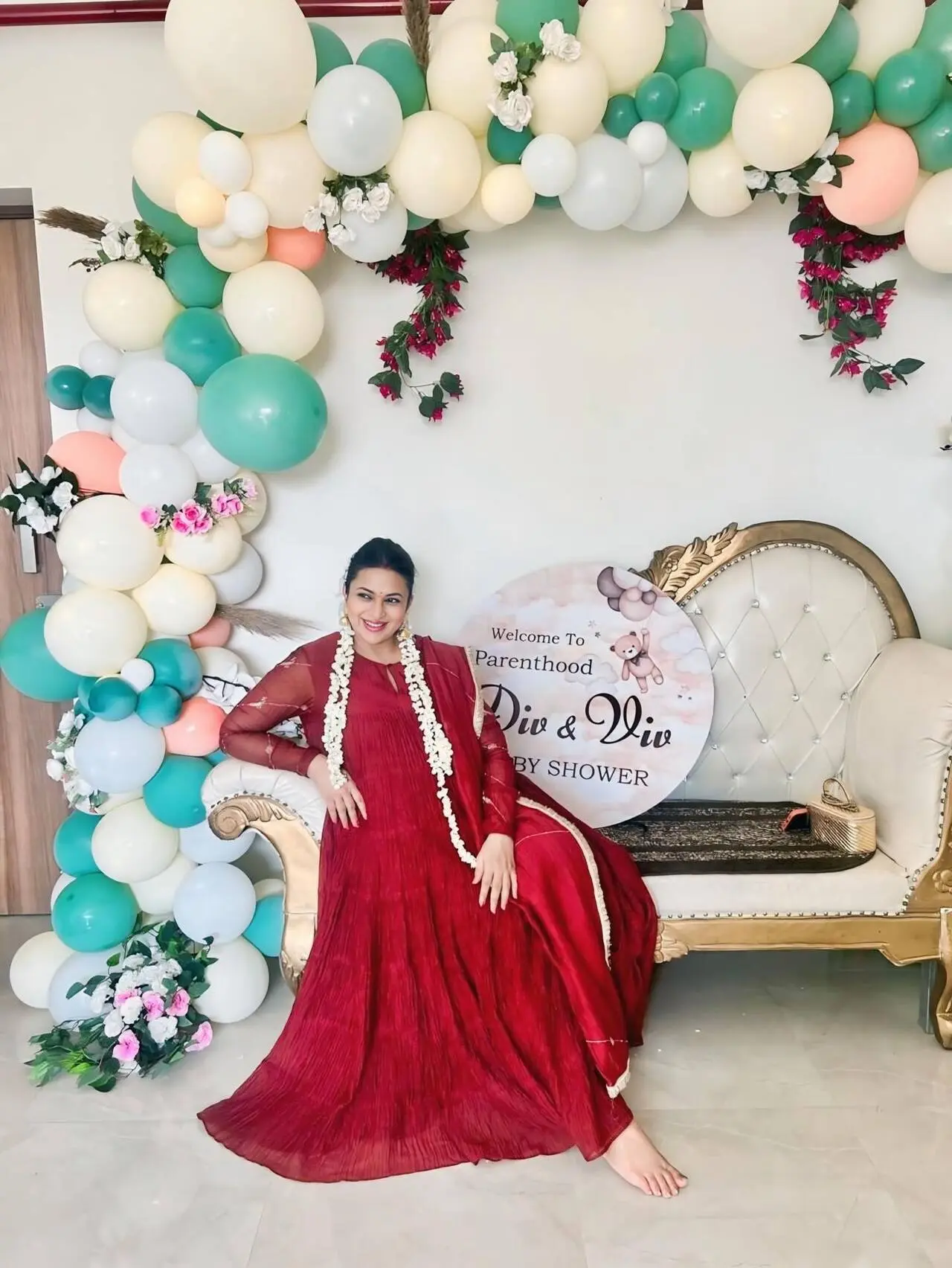 Divyanka looked radiant in a flowing red ethnic outfit, paired with traditional jewellery and floral gajra, and was seen proudly flaunting her baby bump during her intimate baby shower ceremony.