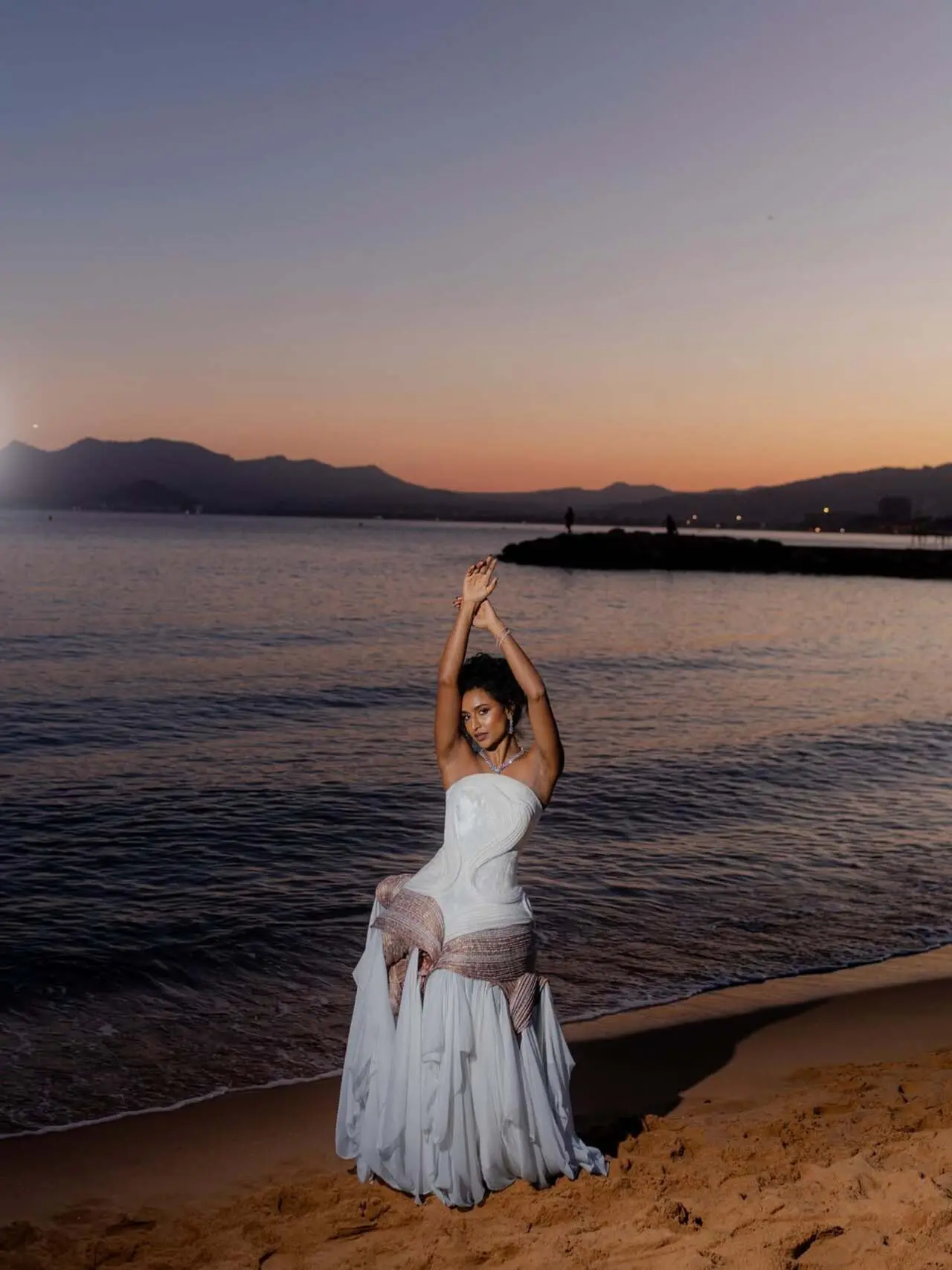 Rida Tharana
Rida Tharana is a model and content creator. She stunned in an ivory couture gown featuring a strapless corset bodice with sculpted, curved paneling. She chose a custom creation by Indian designer Nikhil Gajare.