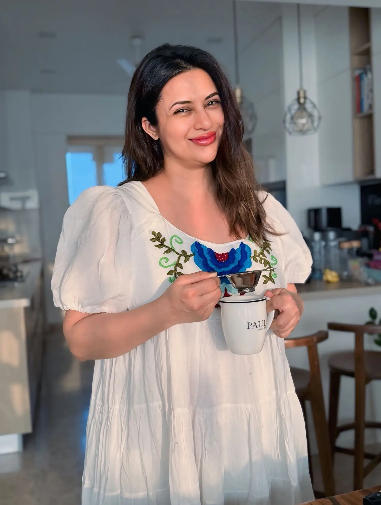 Divyanka Tripathi opted for a breezy white embroidered maxi dress that perfectly blended comfort with chic maternity fashion.&nbsp;