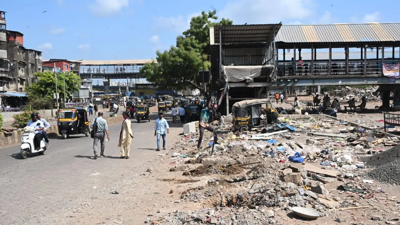 Labourers remove rubble while preparing for fencing installations at Garib Nagar after the demolition of illegal structures in Bandra East Labourers remove rubble while preparing for fencing installations at Garib Nagar after the demolition of illegal structures in Bandra East