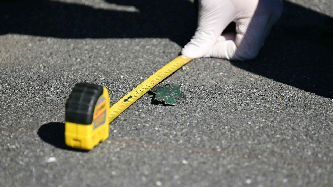 Investigators collect and measure pieces of debris believed to be from the Russian drone as authorities launch a detailed probe Investigators collect and measure pieces of debris believed to be from the Russian drone as authorities launch a detailed probe