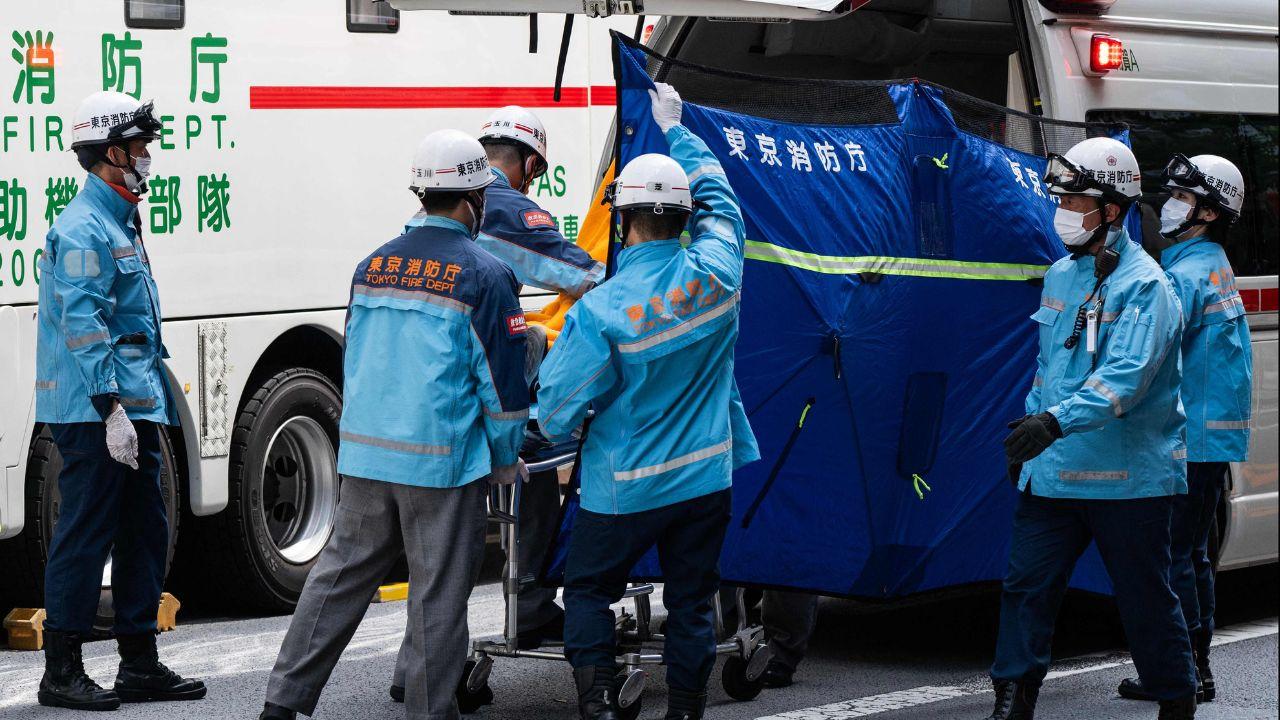 Firefighters and officials dressed in hazmat suits brought people from the mall into specialised trucks to examine them Firefighters and officials dressed in hazmat suits brought people from the mall into specialised trucks to examine them