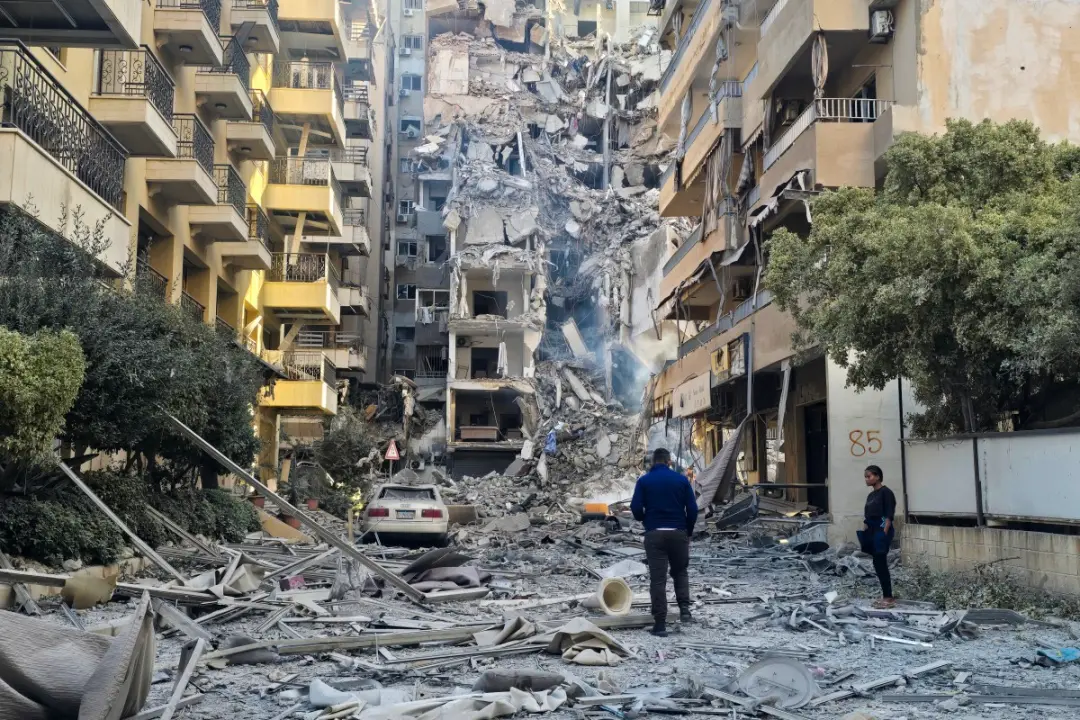 US-Iran deal awaits Trump nod; Gaza and Lebanon tensions escalate; Swiss attack injures three People look at the damages at the site of an Israeli strike in Tyre, southern Lebanon, on Thursday. PIC/AFP