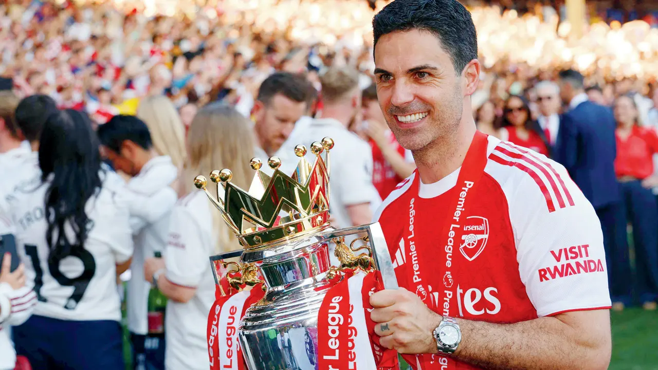 Arsenal boss Mikel Arteta with  the EPL trophy on Sunday. pic/AFP