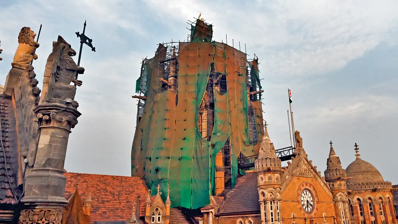 Scaffolding and safety nets cover parts of the CSMT dome during ongoing restoration work