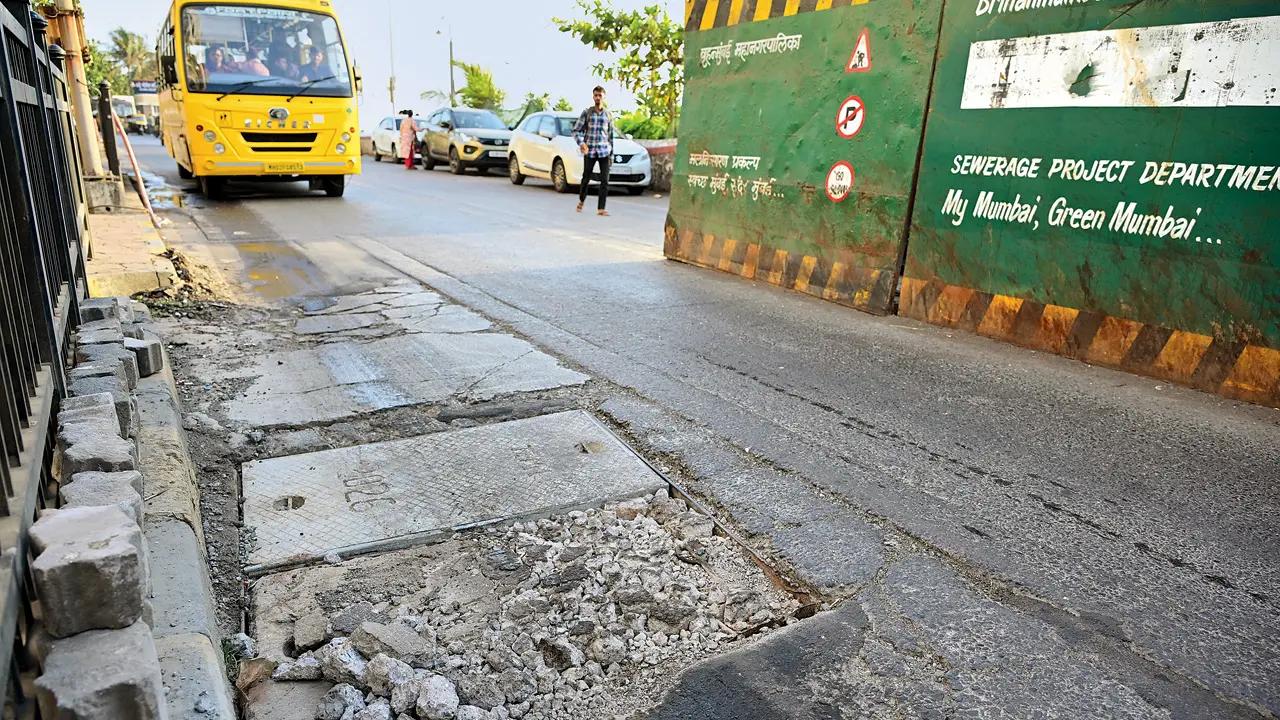Mumbai LIVE: Broken drain cover sparks safety concerns near SRK's home in Bandra The broken concrete drain cover and debris on the construction-hit Bandstand road in Bandra West. Pic/ Shadab Khan
