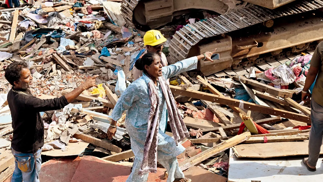 Garib Nagar demolition: HC protection order doesn’t prevent 100 families from going homeless Fardina Shaikh (centre), who points animatedly to a broken-down structure, alleges that the use of heavy machinery damaged her home at Garib Nagar. PICS/SAMEER SAYYED ABEDI