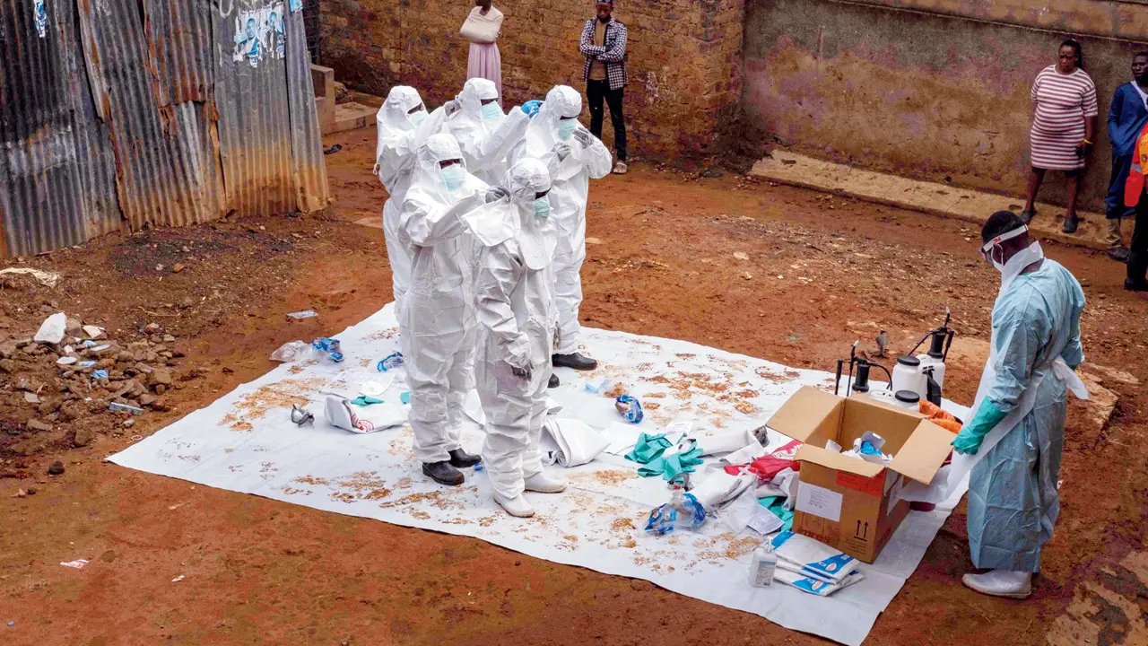 New Russian vaccine may protect against rare Bundibugyo Ebola strain Workers in Uganda prepare to handle a body. PIC/AFP