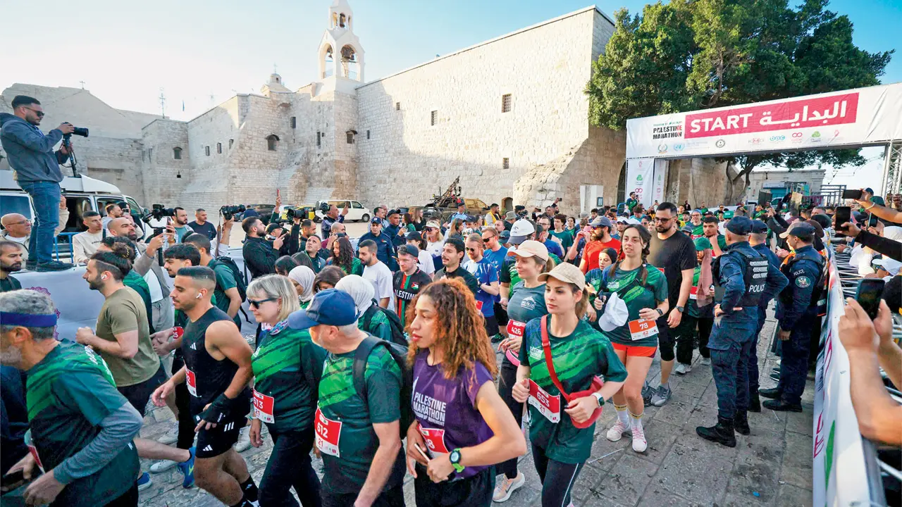 Hundreds of Palestinians and foreign nationals take off from Manager Square at the start of the annual Palestine Marathon, in Bethlehem on Friday, as the US-Israel-Iran ceasefire held. PIC/AFP
