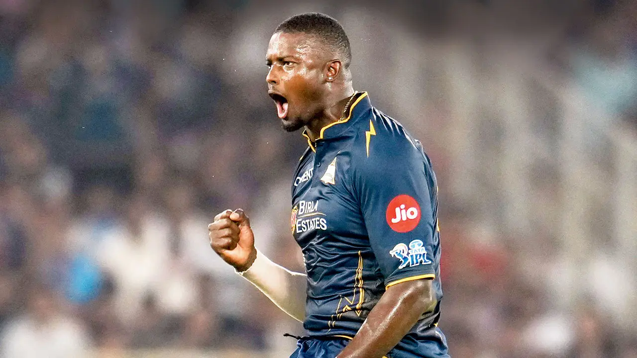 GT’s Jason Holder is ecstatic after dismissing RCB’s Jitesh Sharma in Ahmedabad on Thursday. Pic/PTI