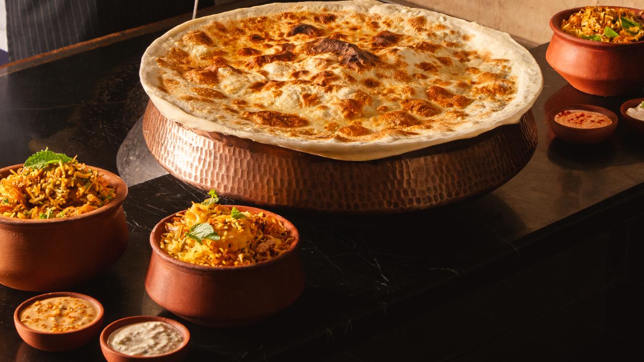 Biryani lovers can unite&nbsp;This Eid, Kadak is bringing people together over a table full of flavour because they have curated 'Biryani Feast', a special Eid feast that celebrates biryani in its most loved regional forms, making it a perfect pick for anyone looking to enjoy a hearty festive meal with family or friends.
The menu features a rich Hyderabadi Mutton Biryani, slow-cooked with fragrant saffron, fried onions and tender meat, along with a delicate Kolkata Biryani, known for its signature soft potatoes and subtle aromatic spices.&nbsp;
Where: Kadak, ICONIQA, Andheri East&nbsp;When: Till May 31Time: 6:30 am to 11:30 pmPrice: Use code KADAK@25 while booking and enjoy 25 per cent off your dining experienceCall: 022 6188 6177 for more details