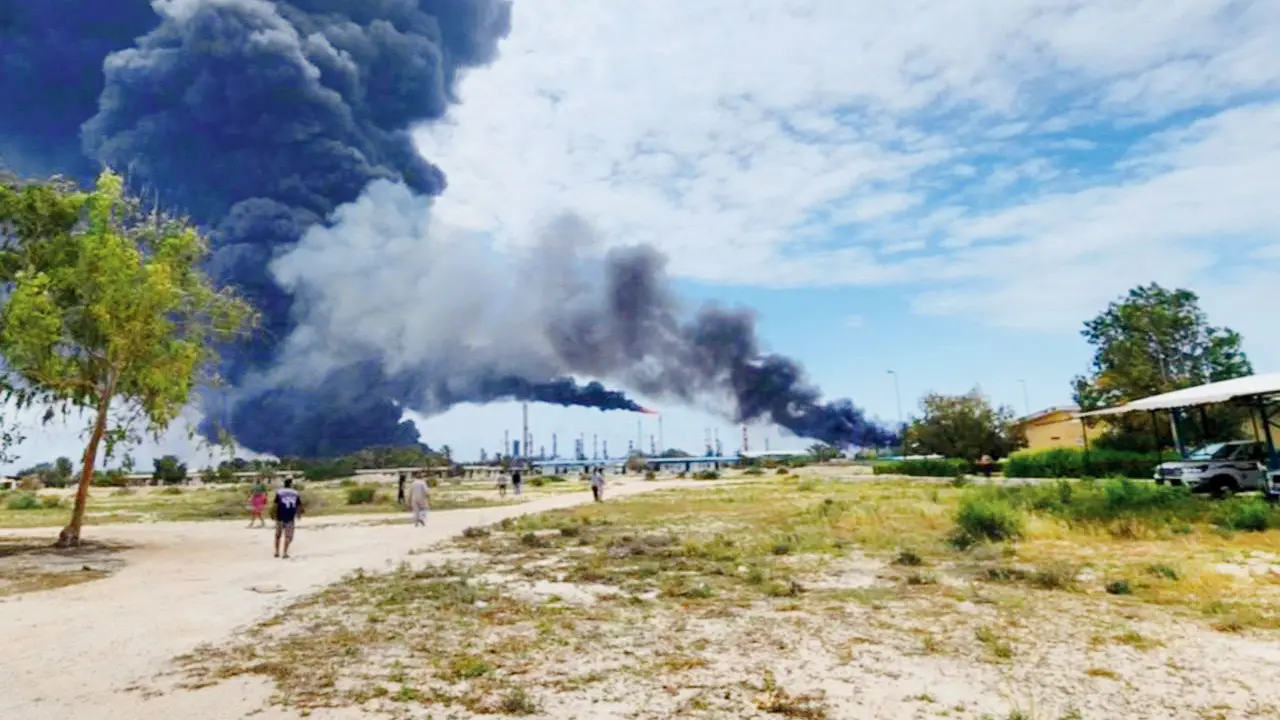 West Asia Conflict: Secret UAE strike hits Iran’s Lavan Island oil refinery Heavy smoke seen from within the Lavan Oil Refinery on Lavan Island in the Persian Gulf. PIC/AFP
