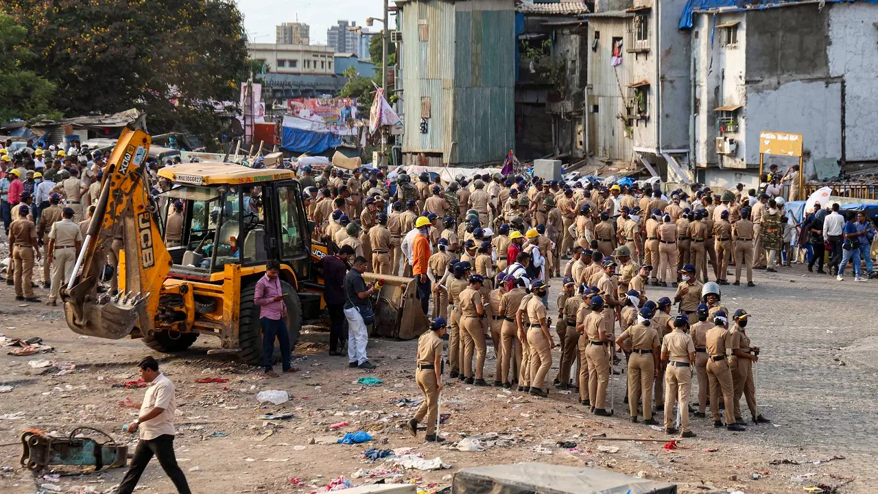 Mumbai: 10 booked for violence during Garib Nagar demolition drive in Bandra Police personnel remain deployed during an anti-encroachment drive in the Garib Nagar slum area near Bandra railway station. Pic/PTI