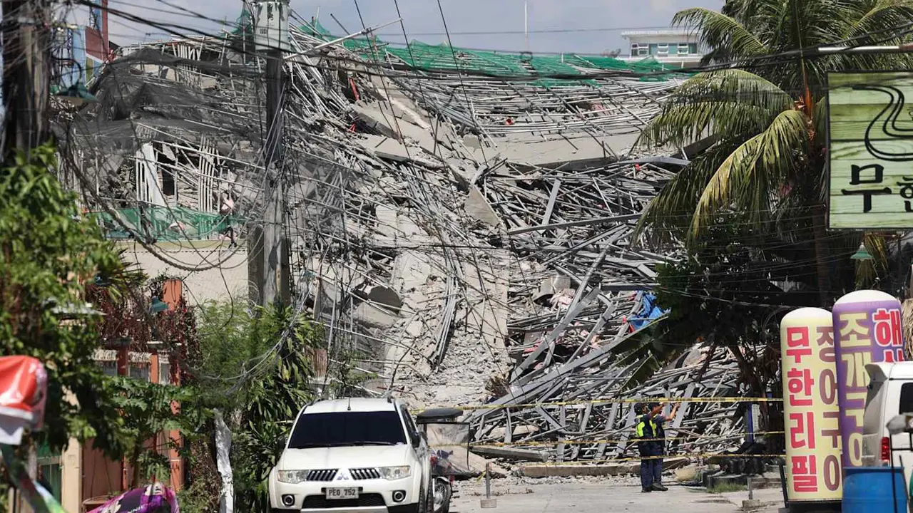 Building under construction collapses in Philippines; over 20 trapped under debris Rescuers established contact with two people. PIC/AFP