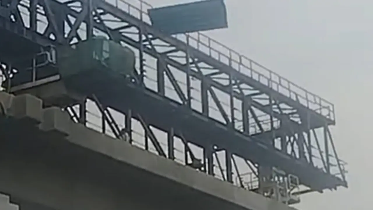 Narrow escape for commuter after iron sheets fall on Mumbai-Pune Highway in PCMC Around 3 pm on Saturday, sudden gusty winds swept through the area, causing the iron sheets of the temporary structure to break loose and fly onto the busy highway. PIC/BY SPECIAL ARRANGEMENT