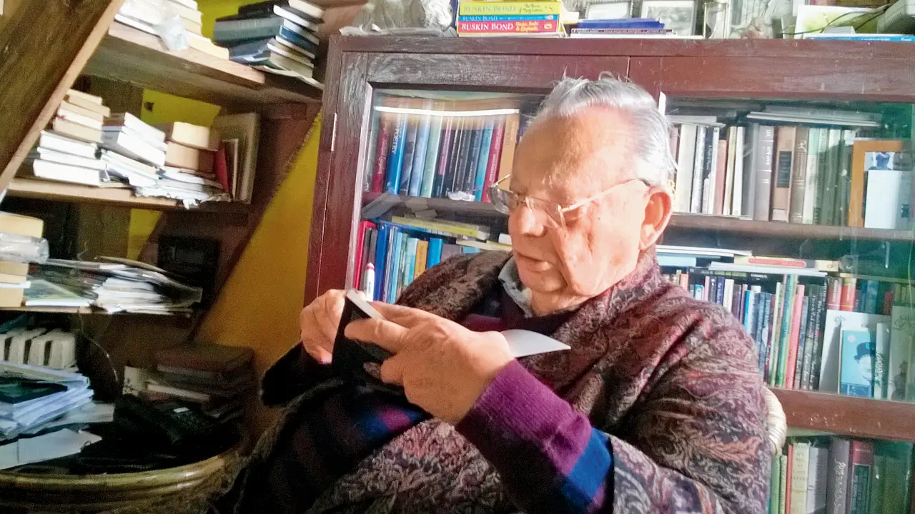 mid-day Opinion: Magic from the mundane Ruskin Bond beside his favourite seat by the overflowing bookshelf
