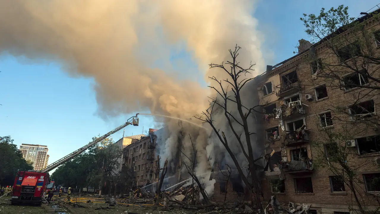 Russia deploys Oreshnik hypersonic missile in Kyiv strike that killed two: Zelenskyy Firefighters work to extinguish a blaze at a heavily damaged building following Russian strikes in Kyiv on Sunday. PIC/AFP